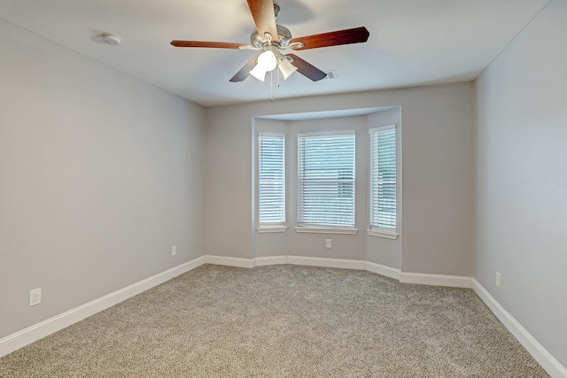 7112 Ave L, Houston, TX 77011 - carpeted spare room featuring ceiling fan, baseboards, and a smoke detector