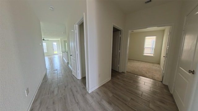 4322 Mossy Banks Ln, Houston, TX 77068 - corridor with light wood-style flooring and baseboards