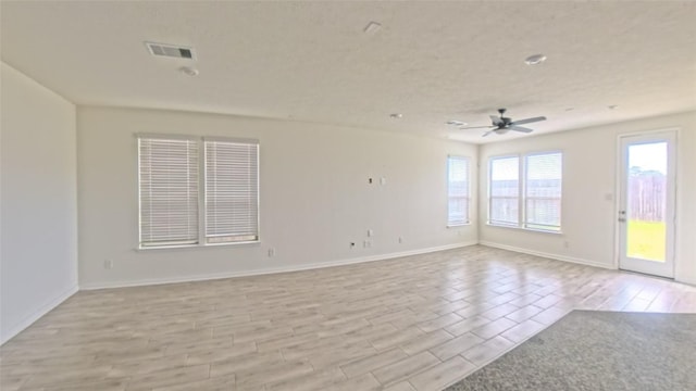 4322 Mossy Banks Ln, Houston, TX 77068 - empty room featuring a ceiling fan, light wood-style floors, and baseboards