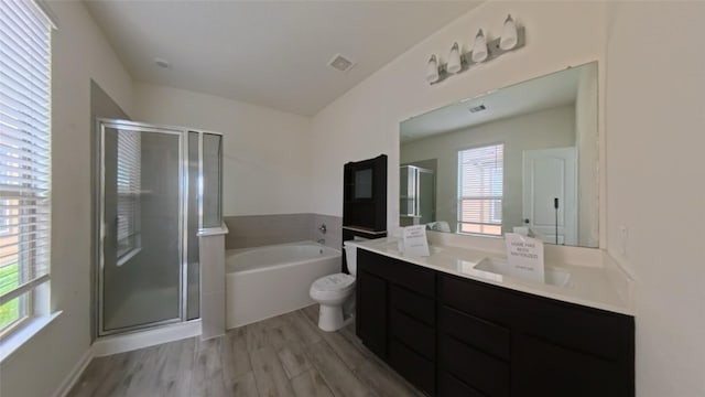 4322 Mossy Banks Ln, Houston, TX 77068 - bathroom featuring vanity, a shower stall, a garden tub, and healthy amount of natural light