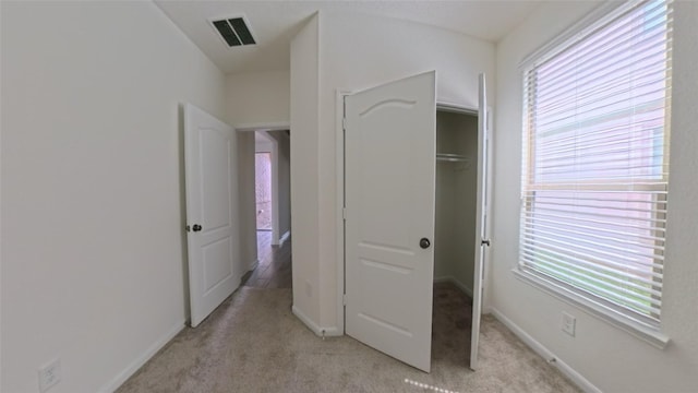4322 Mossy Banks Ln, Houston, TX 77068 - unfurnished bedroom with a closet, light carpet, and baseboards