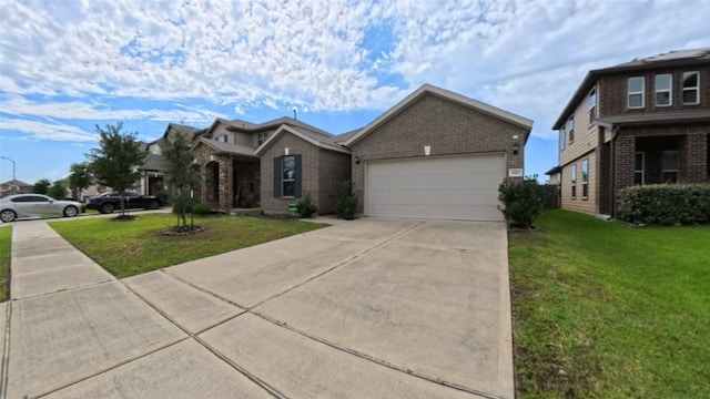 4322 Mossy Banks Ln, Houston, TX 77068 - view of front of home featuring brick siding, a garage, a front yard, and concrete driveway