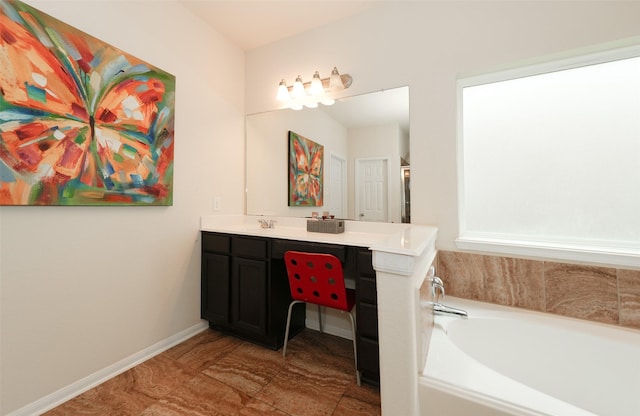 3314 Tall Sycamore Trl, Katy, TX 77493 - bathroom with a bath, double vanity, and baseboards