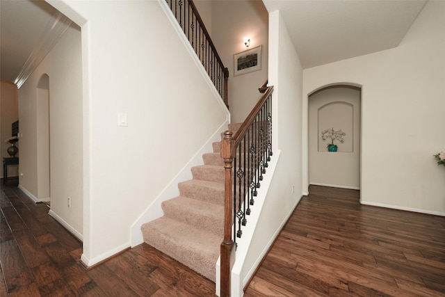 3314 Tall Sycamore Trl, Katy, TX 77493 - stairway with arched walkways, wood finished floors, baseboards, and ornamental molding