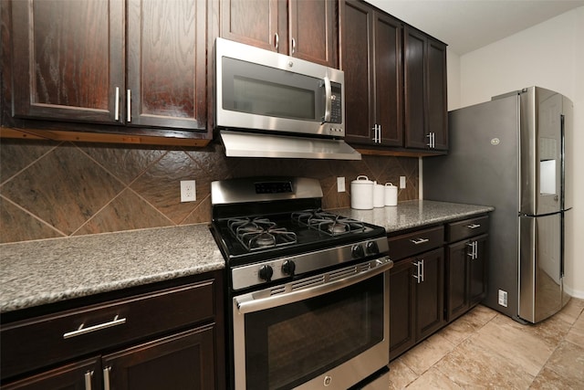 3314 Tall Sycamore Trl, Katy, TX 77493 - kitchen with stainless steel appliances, dark brown cabinets, backsplash, and ventilation hood