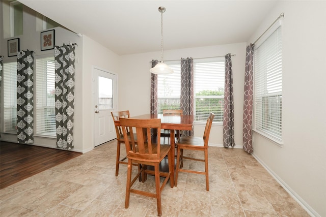 3314 Tall Sycamore Trl, Katy, TX 77493 - dining space with baseboards and stone finish flooring