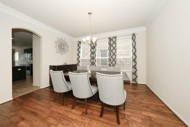 3314 Tall Sycamore Trl, Katy, TX 77493 - dining area featuring arched walkways, a chandelier, ornamental molding, wood finished floors, and baseboards