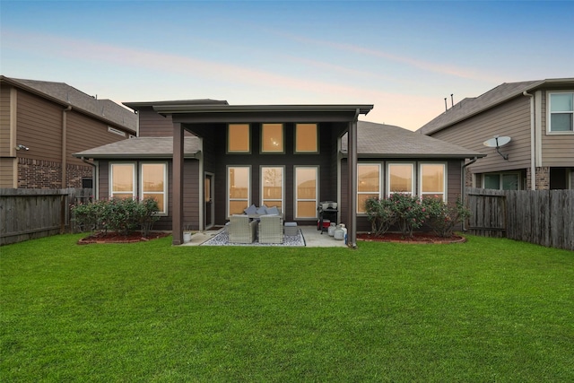 3314 Tall Sycamore Trl, Katy, TX 77493 - back of house at dusk featuring a patio area
