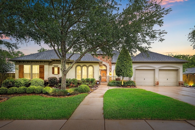 212 Salmon Creek Ln, Friendswood, TX 77546 - view of front of house with stucco siding, concrete driveway, an attached garage, and roof with shingles