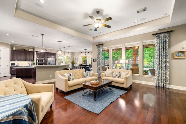 212 Salmon Creek Ln, Friendswood, TX 77546 - living area with a tray ceiling, healthy amount of natural light, a ceiling fan, baseboards, and recessed lighting