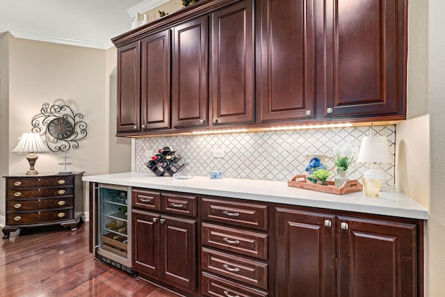 212 Salmon Creek Ln, Friendswood, TX 77546 - kitchen featuring wine cooler, backsplash, light countertops, dark wood-style flooring, and ornamental molding
