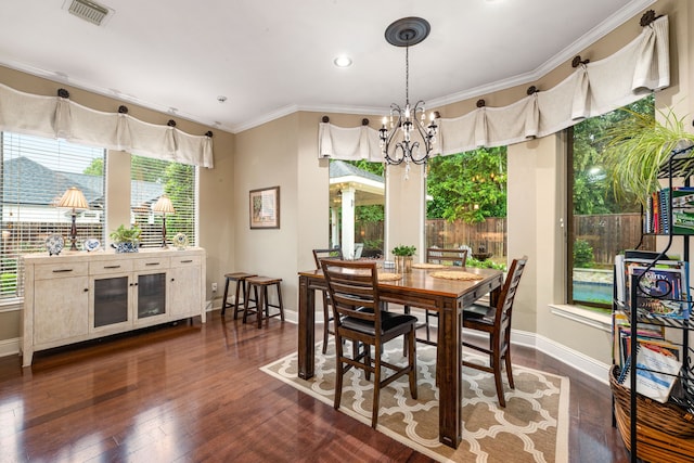 212 Salmon Creek Ln, Friendswood, TX 77546 - dining area featuring a chandelier, baseboards, dark wood-type flooring, ornamental molding, and recessed lighting