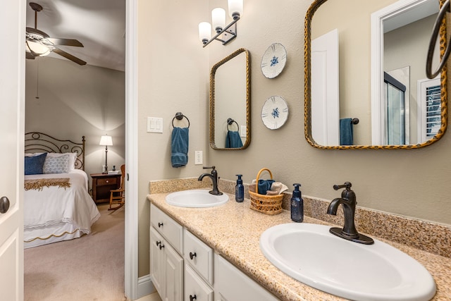 212 Salmon Creek Ln, Friendswood, TX 77546 - ensuite bathroom featuring a ceiling fan, double vanity, and a shower with door