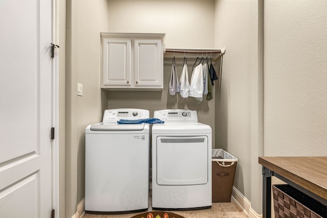 212 Salmon Creek Ln, Friendswood, TX 77546 - washroom featuring cabinet space, independent washer and dryer, and baseboards