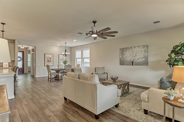 109 Pepper Grass Pl, Montgomery, TX 77316 - living area featuring a chandelier, a ceiling fan, wood finished floors, baseboards, and recessed lighting