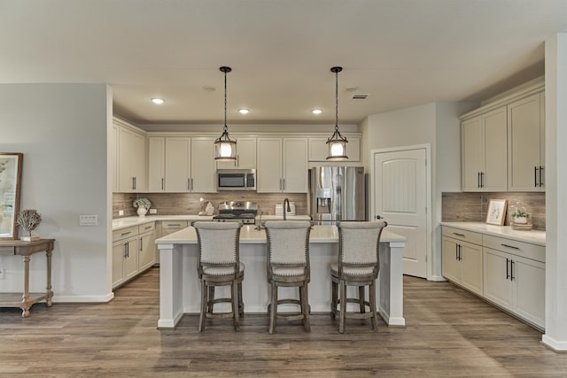 109 Pepper Grass Pl, Montgomery, TX 77316 - kitchen featuring appliances with stainless steel finishes, decorative backsplash, dark wood finished floors, and recessed lighting