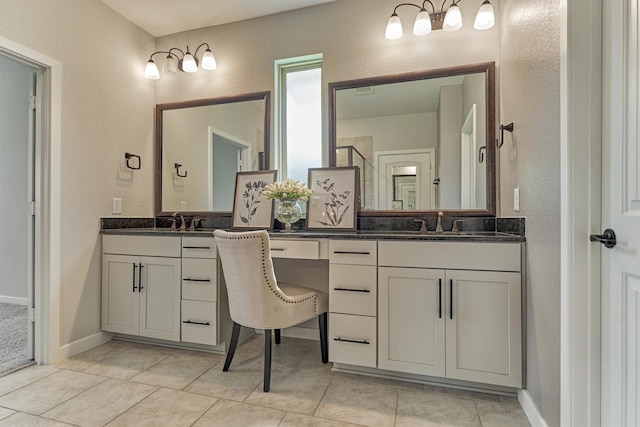 109 Pepper Grass Pl, Montgomery, TX 77316 - bathroom featuring a textured wall, vanity, tile patterned flooring, and baseboards