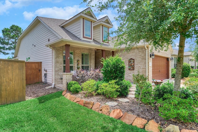 109 Pepper Grass Pl, Montgomery, TX 77316 - view of front of home featuring brick siding, an attached garage, a shingled roof, and a porch