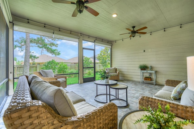 109 Pepper Grass Pl, Montgomery, TX 77316 - living area featuring ceiling fan and wooden walls