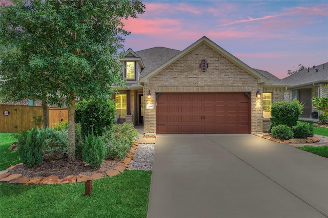 109 Pepper Grass Pl, Montgomery, TX 77316 - view of front of house with brick siding, an attached garage, and concrete driveway