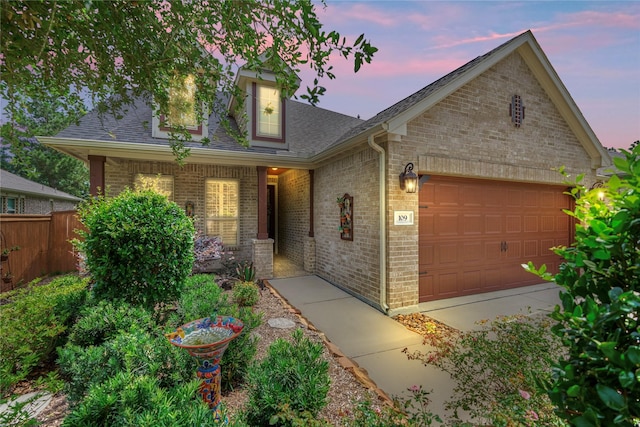 109 Pepper Grass Pl, Montgomery, TX 77316 - view of front of house featuring brick siding, roof with shingles, and a garage