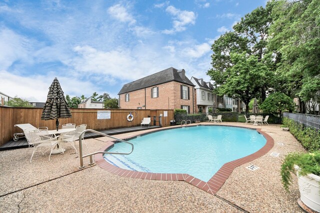 405 N Post Oak Ln Unit 405, Houston, TX 77024 - community pool featuring outdoor dining space and a patio