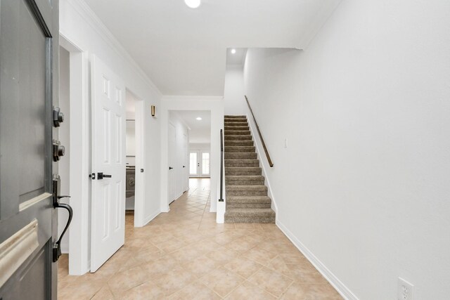 405 N Post Oak Ln Unit 405, Houston, TX 77024 - foyer entrance featuring stairway, light tile patterned flooring, baseboards, recessed lighting, and crown molding
