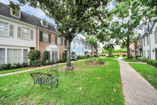 405 N Post Oak Ln Unit 405, Houston, TX 77024 - view of home's community featuring a lawn and a residential view