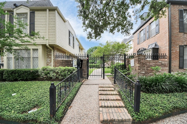 405 N Post Oak Ln Unit 405, Houston, TX 77024 - view of side of property featuring a gate and brick siding