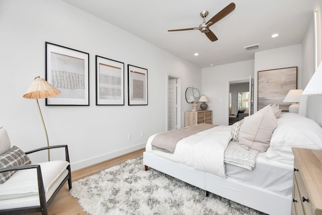 4020 Boho Ln, Houston, TX 77045 - bedroom with light wood-type flooring, recessed lighting, baseboards, and ceiling fan