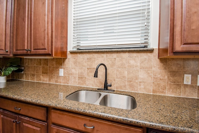 321 W 26th St Unit A, Houston, TX 77008 - kitchen with a sink, light stone counters, decorative backsplash, and brown cabinets