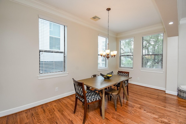 321 W 26th St Unit A, Houston, TX 77008 - dining area featuring a chandelier, baseboards, crown molding, light wood-style floors, and recessed lighting