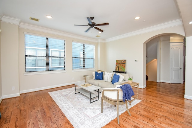 321 W 26th St Unit A, Houston, TX 77008 - living room with arched walkways, ceiling fan, light wood-type flooring, ornamental molding, and baseboards