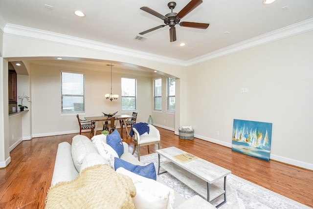 321 W 26th St Unit A, Houston, TX 77008 - living area with arched walkways, crown molding, wood finished floors, ceiling fan, and baseboards