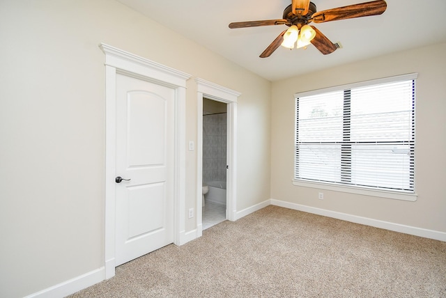 321 W 26th St Unit A, Houston, TX 77008 - unfurnished bedroom with light carpet, baseboards, and ensuite bathroom
