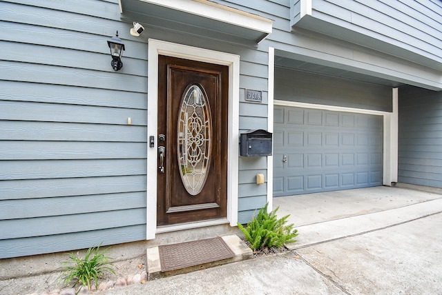 321 W 26th St Unit A, Houston, TX 77008 - doorway to property with driveway, a surveillance system, and an attached garage