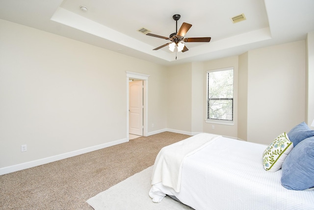 321 W 26th St Unit A, Houston, TX 77008 - bedroom featuring a raised ceiling, carpet floors, baseboards, and a ceiling fan