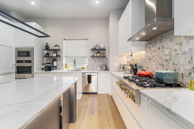 1116 Peden St, Houston, TX 77006 - kitchen featuring wall chimney exhaust hood, appliances with stainless steel finishes, open shelves, backsplash, and recessed lighting