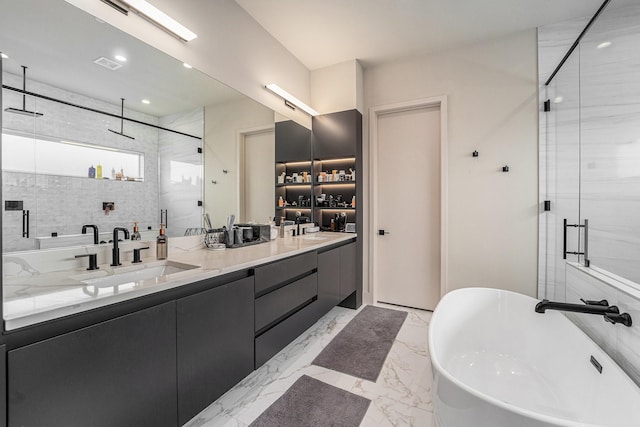 1116 Peden St, Houston, TX 77006 - full bath with a stall shower, double vanity, a freestanding tub, and marble finish floors