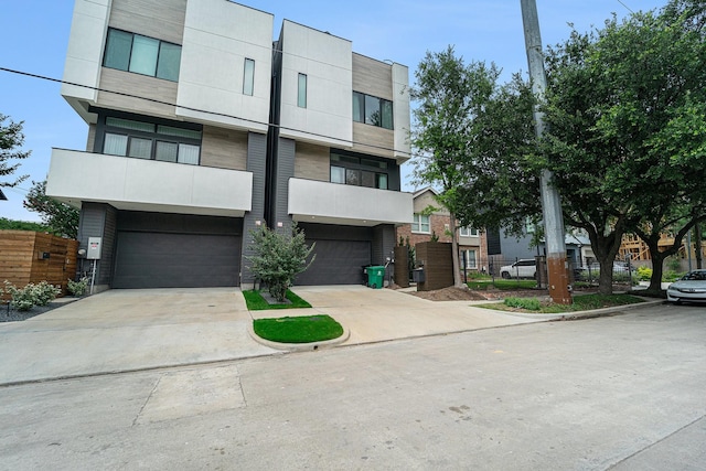 1116 Peden St, Houston, TX 77006 - view of front facade with an attached garage and driveway