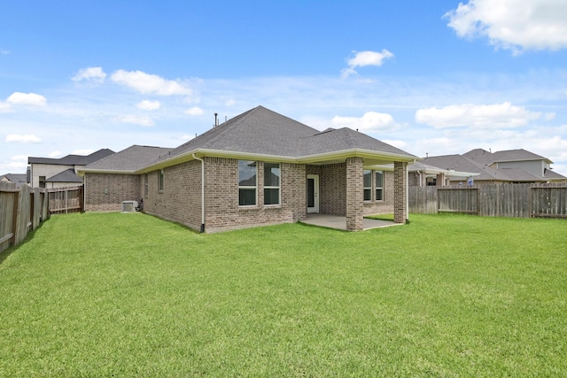 7919 Chantilly Mnr, Fulshear, TX 77441 - rear view of property featuring a patio, cooling unit, brick siding, and roof with shingles