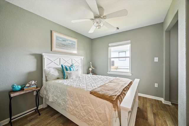 219 Bora Bora Dr, Tiki Island, TX 77554 - bedroom featuring wood finished floors, baseboards, and ceiling fan