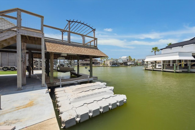 219 Bora Bora Dr, Tiki Island, TX 77554 - dock area featuring a water view
