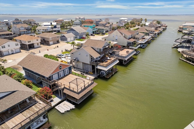 219 Bora Bora Dr, Tiki Island, TX 77554 - aerial perspective of suburban area featuring a large body of water