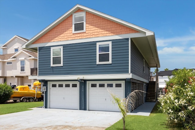 219 Bora Bora Dr, Tiki Island, TX 77554 - view of side of home featuring a garage and driveway