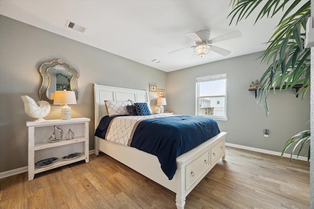 219 Bora Bora Dr, Tiki Island, TX 77554 - bedroom featuring wood finished floors, baseboards, and ceiling fan