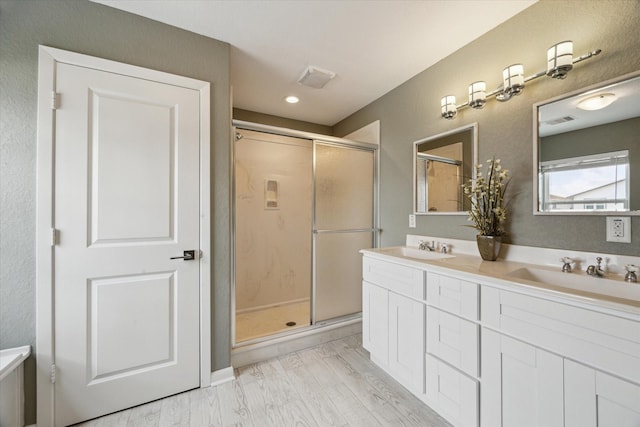 219 Bora Bora Dr, Tiki Island, TX 77554 - bathroom with a shower stall and double vanity