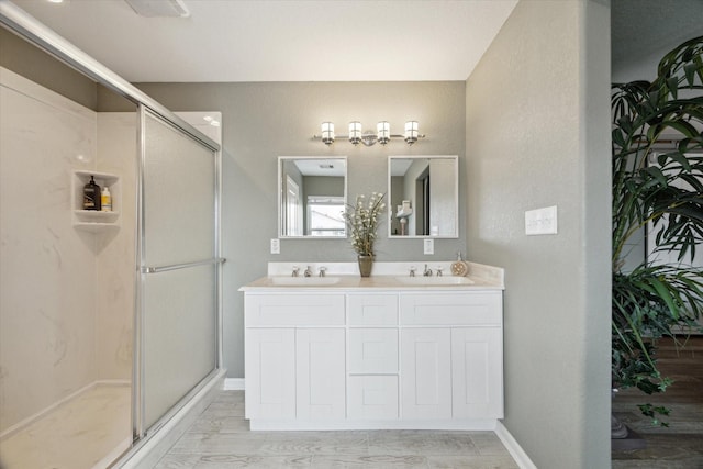 219 Bora Bora Dr, Tiki Island, TX 77554 - bathroom featuring a shower stall and double vanity