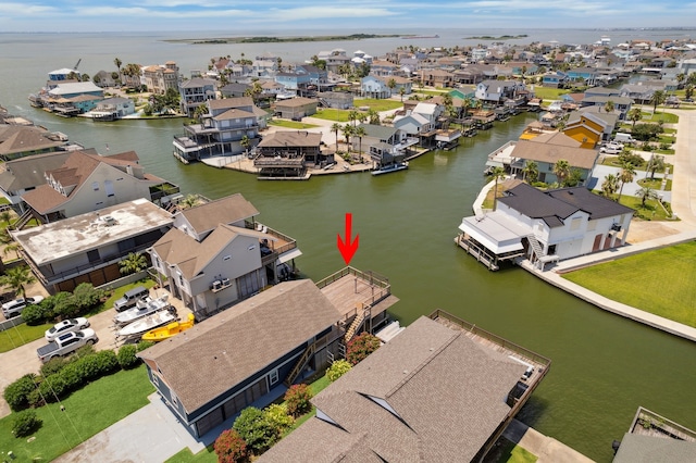 219 Bora Bora Dr, Tiki Island, TX 77554 - aerial view of residential area featuring a large body of water