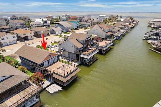 219 Bora Bora Dr, Tiki Island, TX 77554 - aerial view of residential area featuring a large body of water